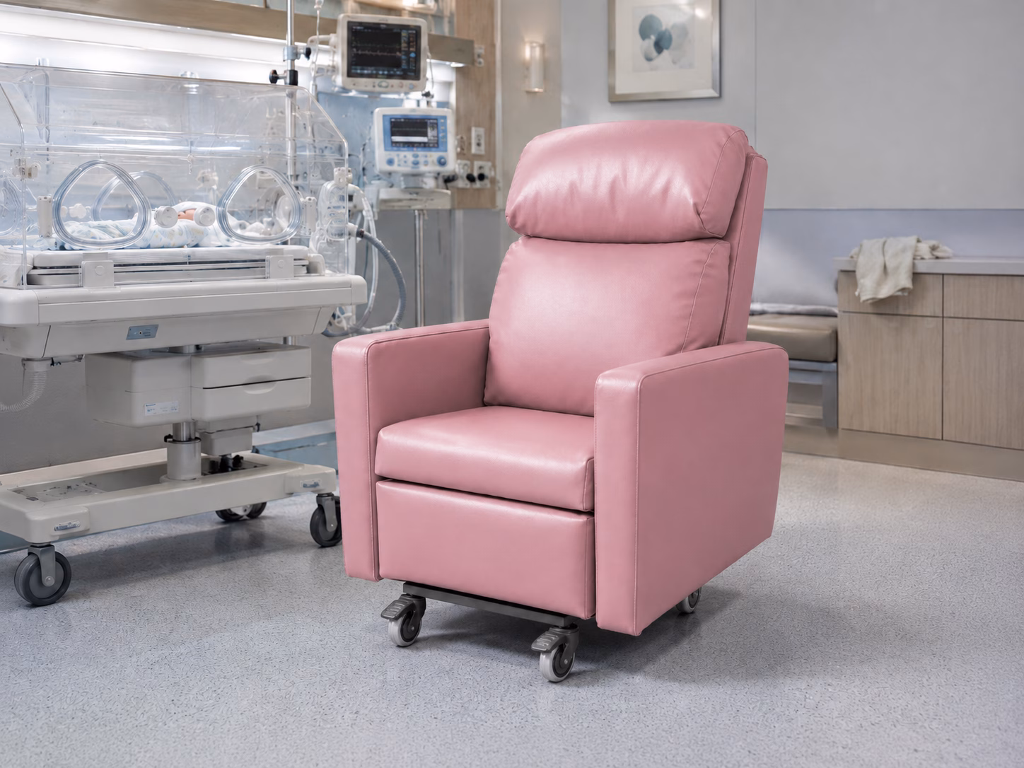 Pink breastfeeding chair beside a neonatal cot in a hospital room concept